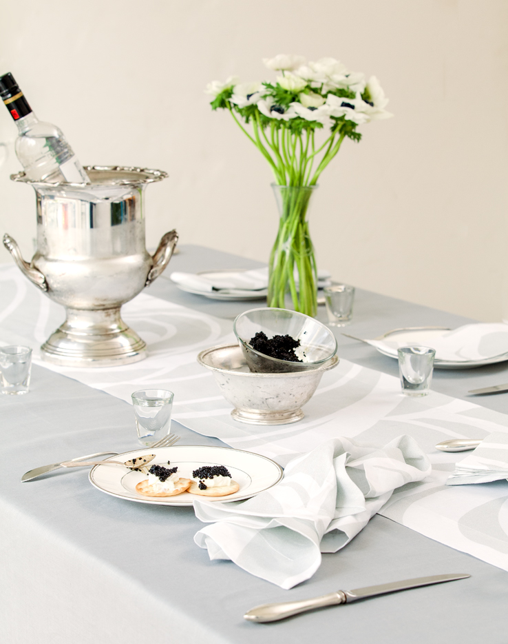 Huddleson silver grey Italian linen tablecloth and Sloan swirl silver and grey table runner and napkin. Vodka and caviar party. 