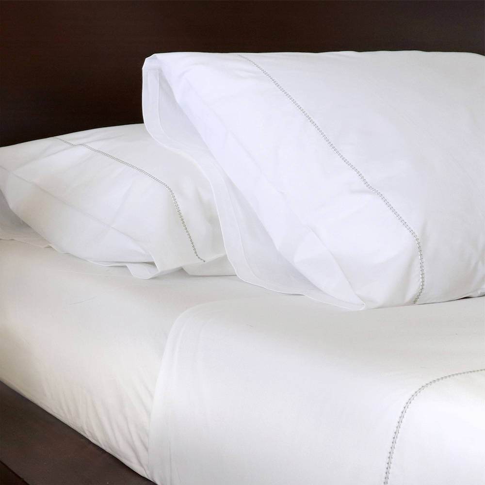 White luxury cotton sheets with green hemstitch trim 