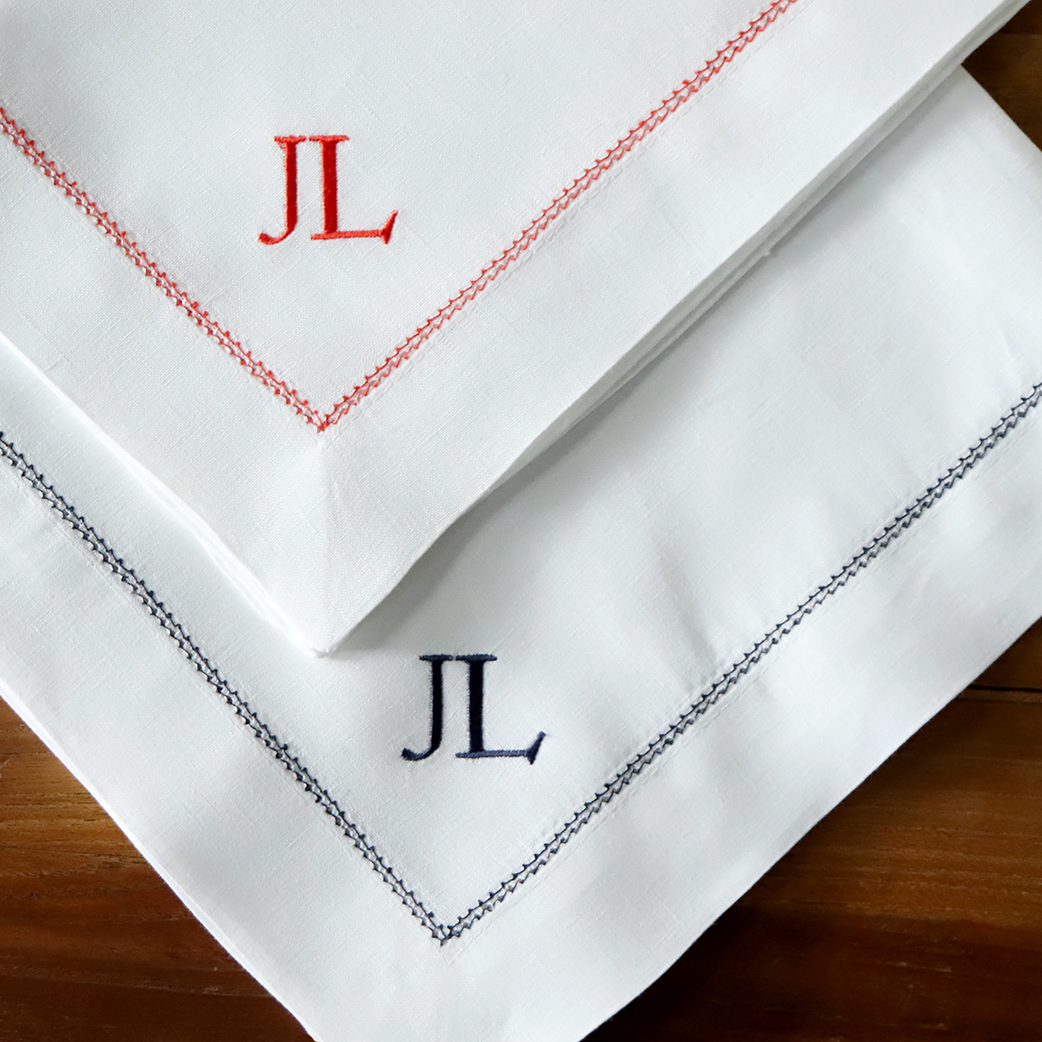 Monogrammed napkins with matching hemstitch trim luxury tablesetting