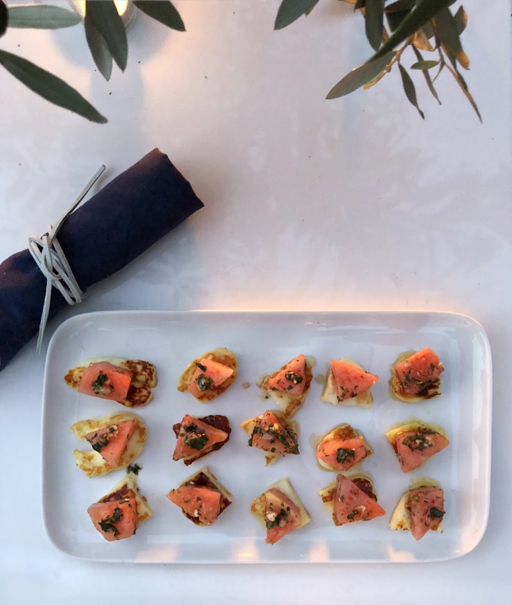 Halloumi watermelon appetizer navy blue linen napkin Greek dinner party