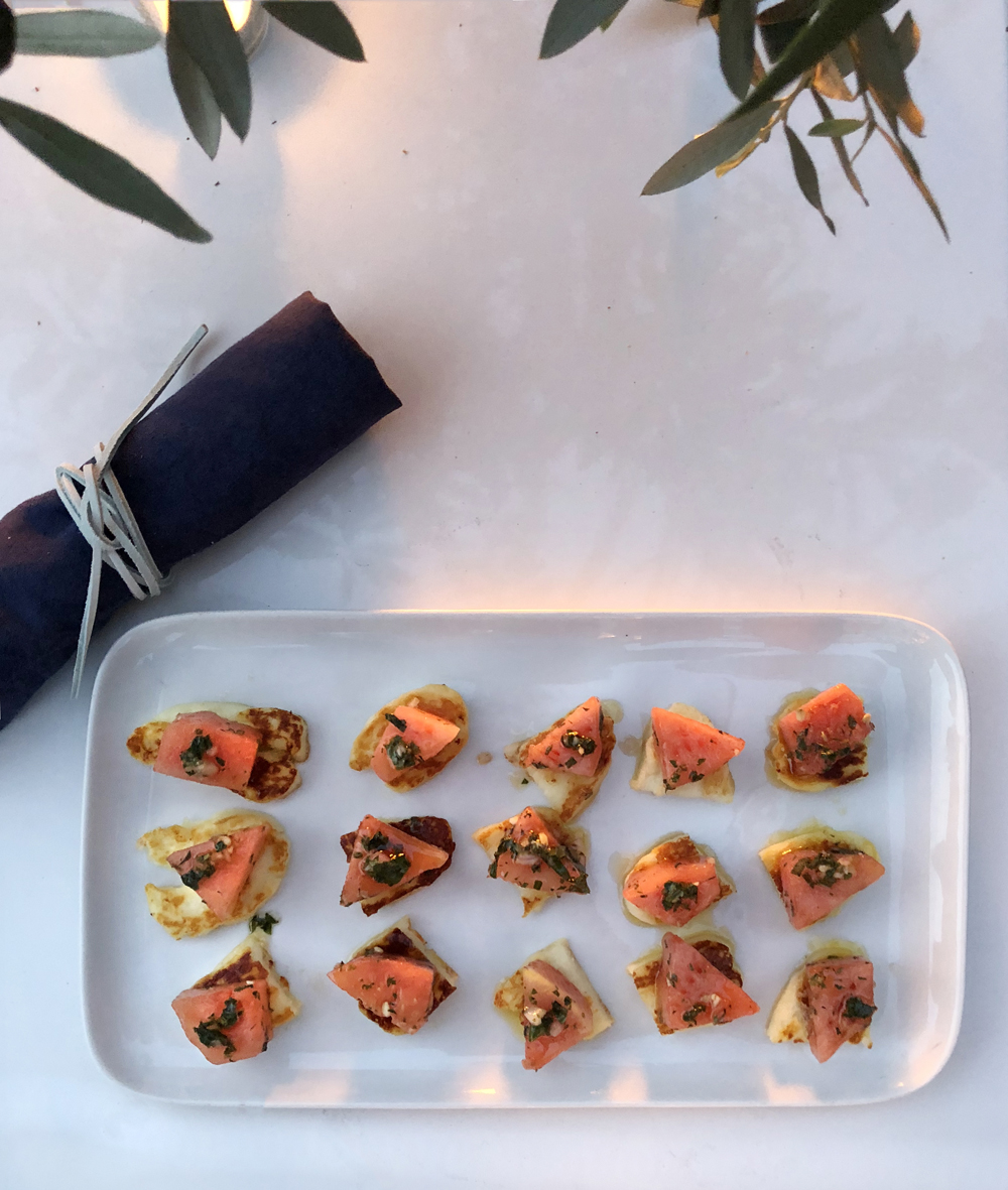 Halloumi watermelon appetizer navy blue linen napkin Greek dinner party