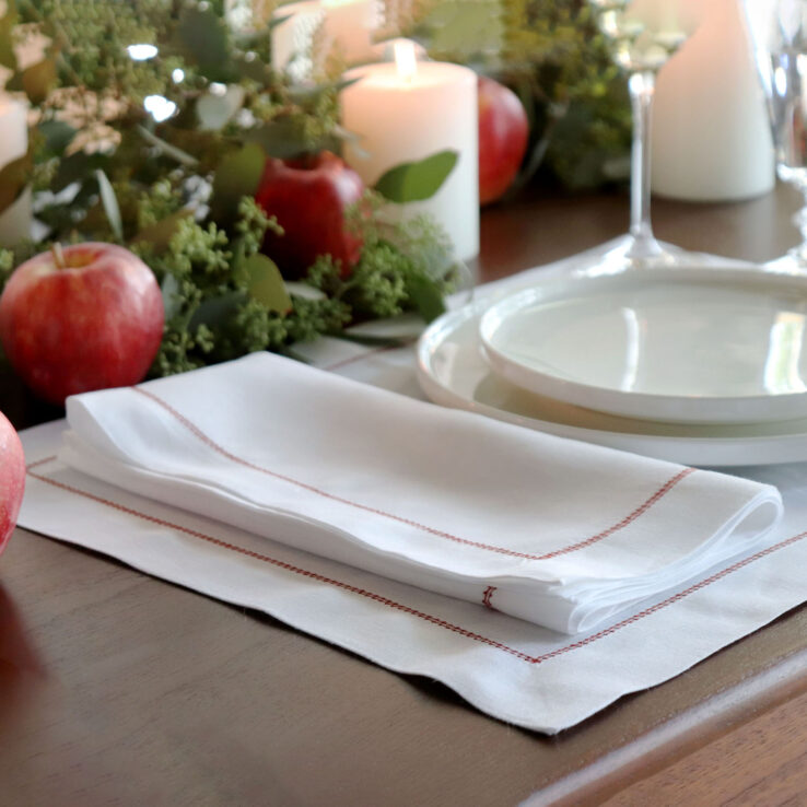 White napkin with red trim hemstitch 